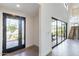 Bright entryway with sleek front door and expansive glass doors and staircase to the upper level at 8510 S 9Th Dr # 20, Phoenix, AZ 85041