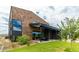 Modern house with striking wooden siding, a black roof and manicured landscaping at 8510 S 9Th Dr # 20, Phoenix, AZ 85041
