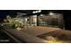 Modern house with a glass door garage, wooden siding, and manicured landscaping at 8510 S 9Th Dr # 20, Phoenix, AZ 85041