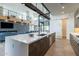 Open-concept kitchen with island, stainless appliances, and easy access to dining and living areas at 8510 S 9Th Dr # 20, Phoenix, AZ 85041
