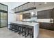 Modern kitchen featuring a large island, bar seating, stainless steel appliances, and ample cabinet space at 8510 S 9Th Dr # 20, Phoenix, AZ 85041