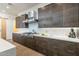 Stylish kitchen features stainless steel hood, sleek countertops, and ample storage space at 8510 S 9Th Dr # 20, Phoenix, AZ 85041