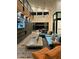 Bright, open living room with a stone accent wall, fireplace and clerestory windows at 8510 S 9Th Dr # 20, Phoenix, AZ 85041