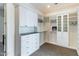Bright walk-in closet with custom shelving, cabinets and drawers at 8510 S 9Th Dr # 20, Phoenix, AZ 85041