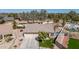 Aerial view of single Gathering house with beautiful desert landscaping and a well-manicured yard at 8554 W Keim Dr, Glendale, AZ 85305