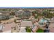 Wide aerial view showcases the home, lush yard, pool, playground, and neighborhood at 8554 W Keim Dr, Glendale, AZ 85305