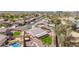 Aerial view showcasing a backyard with a pool, lush landscaping, and outdoor seating area at 8554 W Keim Dr, Glendale, AZ 85305