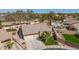 Aerial view of a well-maintained home with desert landscaping and a three-car garage at 8554 W Keim Dr, Glendale, AZ 85305