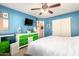 Cheerful bedroom featuring colorful furniture, a large bed, and a ceiling fan for added comfort at 8554 W Keim Dr, Glendale, AZ 85305