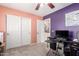 Bedroom featuring a large closet, desk, and a view to the home's exterior at 8554 W Keim Dr, Glendale, AZ 85305