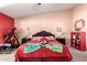 Relaxing bedroom featuring a plush bed with decorative pillows, side tables, and wall decor at 8554 W Keim Dr, Glendale, AZ 85305