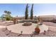 Cozy outdoor fire pit area with unique seating and desert landscaping, perfect for entertaining at 8554 W Keim Dr, Glendale, AZ 85305