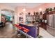 Modern kitchen with stainless steel appliances, granite countertops, and an open layout at 8554 W Keim Dr, Glendale, AZ 85305