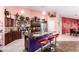 Stylish kitchen with granite countertops, stainless steel appliances, and a breakfast bar with seating at 8554 W Keim Dr, Glendale, AZ 85305