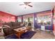 Comfortable living room with large windows, cozy furniture, and unique colorful decor at 8554 W Keim Dr, Glendale, AZ 85305