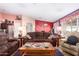 Inviting living room with a large sofa, colorful butterfly decor, and lots of natural light at 8554 W Keim Dr, Glendale, AZ 85305