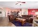 Open living room with two sofas and a view of the kitchen at 8554 W Keim Dr, Glendale, AZ 85305