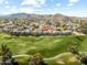Aerial view of homes adjacent to a golf course, offering scenic views and a tranquil setting at 8813 S 51St St # 3, Phoenix, AZ 85044