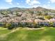 Scenic aerial view showcasing a neighborhood with mountain views and beautifully landscaped green spaces at 8813 S 51St St # 3, Phoenix, AZ 85044