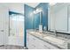 The bathroom boasts double sinks, granite counters and a shower with glass doors at 8813 S 51St St # 3, Phoenix, AZ 85044