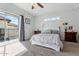Bright bedroom with carpet flooring, featuring a balcony door with a view of the outdoors at 8813 S 51St St # 3, Phoenix, AZ 85044