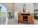 Hallway with carpet, arched window, antique cabinet, and violin display at 8813 S 51St St # 3, Phoenix, AZ 85044