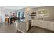Well-lit kitchen featuring white cabinets, granite countertops, stainless steel appliances and open dining area at 8813 S 51St St # 3, Phoenix, AZ 85044