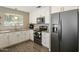 Modern kitchen featuring white cabinets, granite countertops, and stainless steel appliances at 8813 S 51St St # 3, Phoenix, AZ 85044