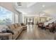 Open-concept living room, with wood floors and lots of seating at 8813 S 51St St # 3, Phoenix, AZ 85044
