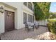 Cozy front patio featuring brick pavers and comfortable outdoor seating area near the front door at 8813 S 51St St # 3, Phoenix, AZ 85044