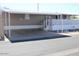 Manufactured home with covered parking and decorative white lattice skirting at 9501 E Broadway Rd # 237, Mesa, AZ 85208