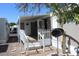 Exterior with covered porch and white picket fence at 9501 E Broadway Rd # 237, Mesa, AZ 85208