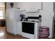 Kitchen with white cabinets, black appliances, and a large refrigerator at 9501 E Broadway Rd # 237, Mesa, AZ 85208