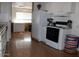 Kitchen area with white cabinets and black appliances at 9501 E Broadway Rd # 237, Mesa, AZ 85208