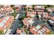 An aerial view of a well-maintained apartment complex featuring red tile roofs and manicured landscaping at 10410 N Cave Creek Rd # 2034, Phoenix, AZ 85020