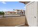 This balcony has views of the community architecture and blue skies at 10410 N Cave Creek Rd # 2034, Phoenix, AZ 85020