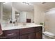 Bathroom featuring a vanity with white countertop, modern fixtures, and a framed mirror at 10410 N Cave Creek Rd # 2034, Phoenix, AZ 85020