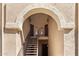 Welcoming entrance featuring stair access to the units above and warm lighting illuminating the way at 10410 N Cave Creek Rd # 2034, Phoenix, AZ 85020