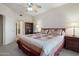 This bright main bedroom features carpet flooring, a ceiling fan and a closet nearby at 10410 N Cave Creek Rd # 2034, Phoenix, AZ 85020