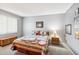 Cozy bedroom featuring neutral walls, carpet, and a decorative quilt on the bed at 10533 W Granada Dr, Sun City, AZ 85373