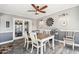 Cozy dining room featuring a hardwood floors, a wooden table, and modern decor at 10533 W Granada Dr, Sun City, AZ 85373