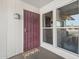 Front porch showcasing a decorative security door, a gnome welcome mat, and natural light windows at 10533 W Granada Dr, Sun City, AZ 85373