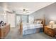 Comfortable main bedroom with a four-poster bed, neutral decor, and ample natural light at 10533 W Granada Dr, Sun City, AZ 85373