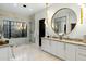 Bright bathroom featuring double sink vanity, marble counters, designer lighting and glass shower at 11268 E Moonlight Cyn, Scottsdale, AZ 85255