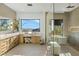 Bathroom featuring dual vanity, walk-in shower, soaking tub, and scenic views at 11268 E Moonlight Cyn, Scottsdale, AZ 85255