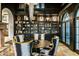 Stylish dining area with built-in shelving, a striking chandelier, and a sophisticated aesthetic at 11268 E Moonlight Cyn, Scottsdale, AZ 85255