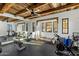 Home exercise room featuring wood beam accents and an array of workout equipment at 11268 E Moonlight Cyn, Scottsdale, AZ 85255