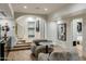 Comfortable sitting room with archway leading to the kitchen, neutral paint colors, and hardwood floors at 11268 E Moonlight Cyn, Scottsdale, AZ 85255