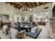 Expansive living room featuring a vaulted wood ceiling, a fireplace, and open concept design at 11268 E Moonlight Cyn, Scottsdale, AZ 85255