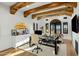 Bright home office with hardwood floors, exposed beam ceilings, desk, and views of the surrounding landscape at 11268 E Moonlight Cyn, Scottsdale, AZ 85255